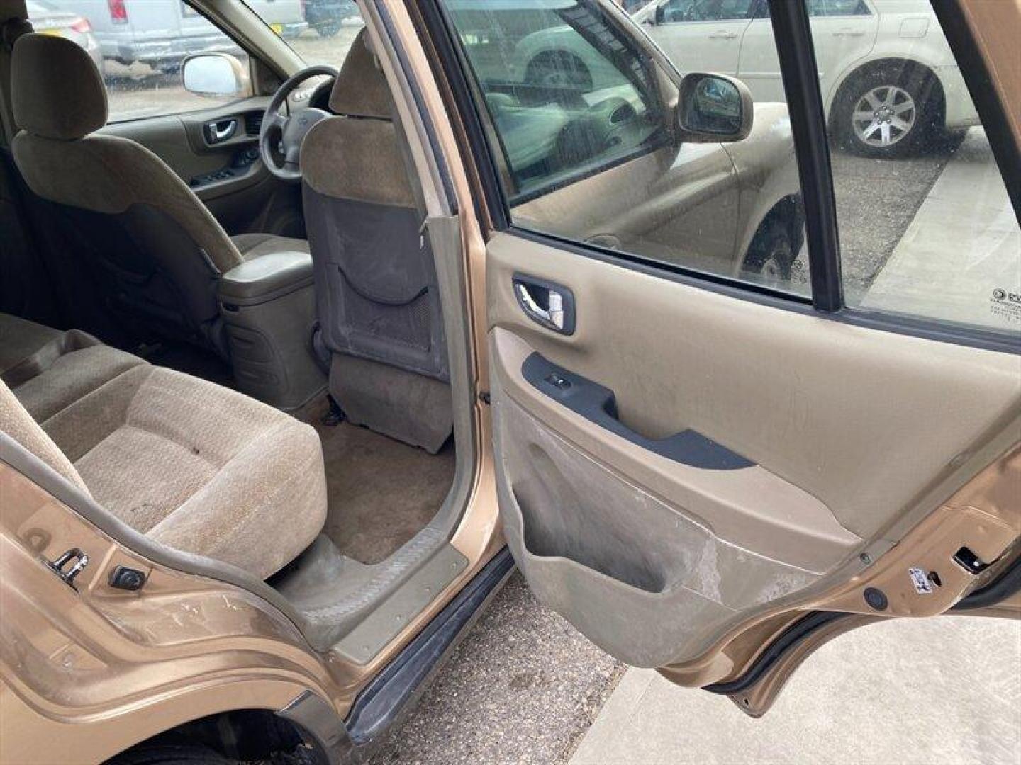 2003 Gold Hyundai SANTA FE (KM8SB12BX3U) with an 2.4L I4 138hp 147ft. lbs. engine, 5 Speed Manual transmission, located at 842 E South Street, Powell, WY, 82435, (307) 754-7289, 44.752300, -108.746933 - Photo#17