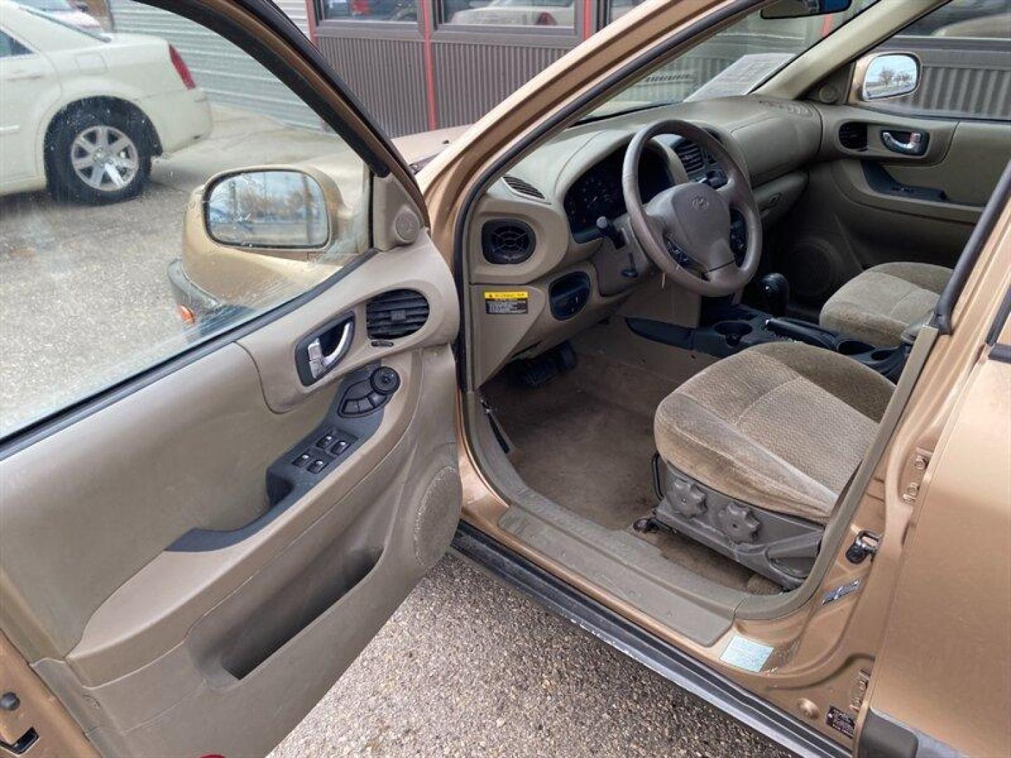 2003 Gold Hyundai SANTA FE (KM8SB12BX3U) with an 2.4L I4 138hp 147ft. lbs. engine, 5 Speed Manual transmission, located at 842 E South Street, Powell, WY, 82435, (307) 754-7289, 44.752300, -108.746933 - Photo#4