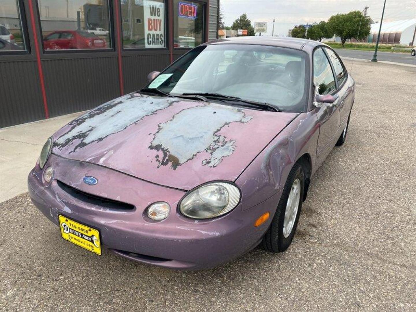 1996 Midnight Red Clearcoat Metallic Ford Taurus GL (1FALP52U2TA) with an 3.0L V6 145hp 170ft. lbs. engine, Automatic transmission, located at 842 E South Street, Powell, WY, 82435, (307) 754-7289, 44.752300, -108.746933 - Photo#0