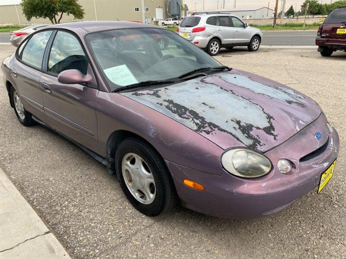 1996 Midnight Red Clearcoat Metallic Ford Taurus GL (1FALP52U2TA) with an 3.0L V6 145hp 170ft. lbs. engine, Automatic transmission, located at 842 E South Street, Powell, WY, 82435, (307) 754-7289, 44.752300, -108.746933 - Photo#1